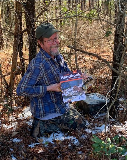 KI5HGX Signing the Logbook and retrieving the Prize. Notice snow is still on the ground! — Sarah Lowery (KI5URZ)
